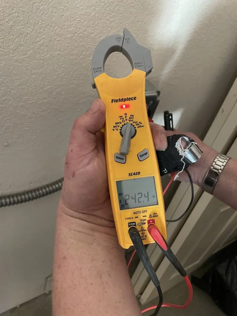 Voltage testing with clamp meter during Electrical Installation Services in O'Fallon